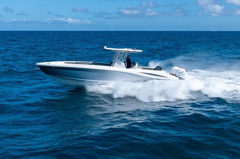 Slide: The Image of 2019 Deep Impact 369 Sport boat cruising on open ocean waters. - 84