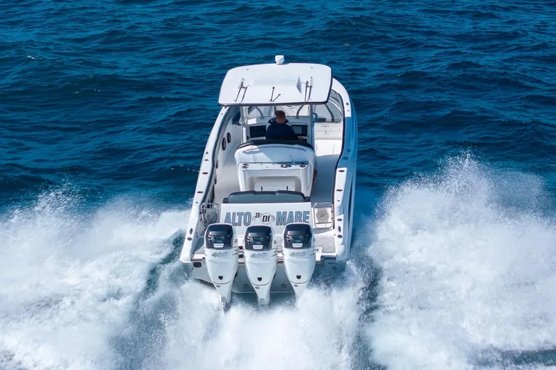 Slide: The Image of 2019 Deep Impact 369 Sport boat speeding on open ocean waters. - 85