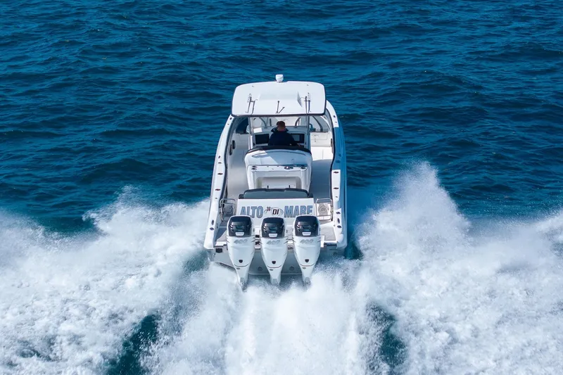 Slide: The Image of 2019 Deep Impact 369 Sport boat cruising on open ocean waters. - 86