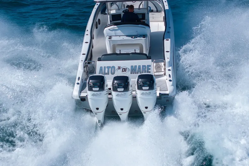Slide: The Image of 2019 Deep Impact 369 Sport boat speeding on water with triple engines. - 88