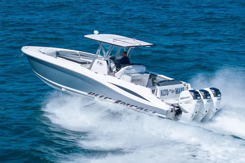 Slide: The Image of 2019 Deep Impact 369 Sport boat cruising on open water with triple Mercury engines. - 90