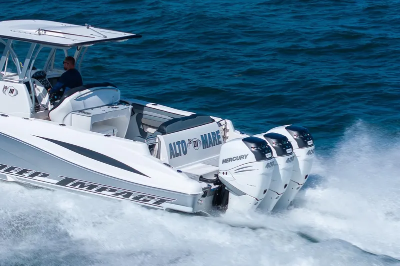 Slide: The Image of 2019 Deep Impact 369 Sport boat cruising with triple Mercury engines on blue ocean. - 93