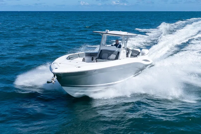 Slide: The Image of 2019 Deep Impact 369 Sport boat cruising on open ocean waters. - 95