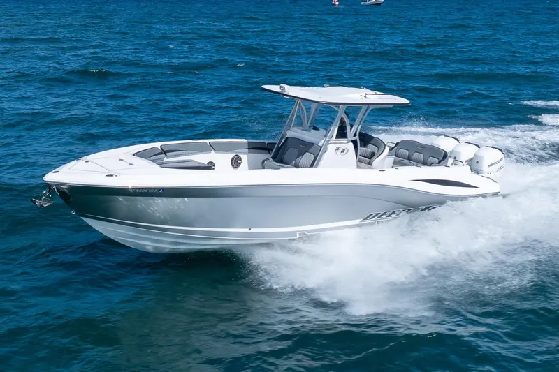 Slide: The Image of 2019 Deep Impact 369 Sport boat cruising on open blue water. - 96