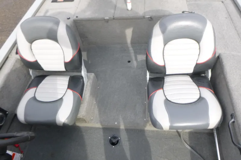 Slide: The Image of 2005 Tracker Tournament V-18 All Fish boat interior with two gray and white seats. - 10