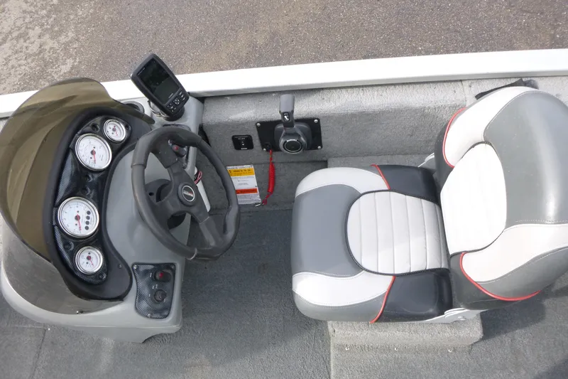 Slide: The Image of 2005 Tracker Tournament V-18 All Fish boat interior with steering wheel and gauges. - 11