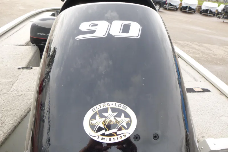 Slide: The Image of 2005 Tracker Tournament V-18 All Fish boat engine with "90" and ultra-low emission sticker. - 14