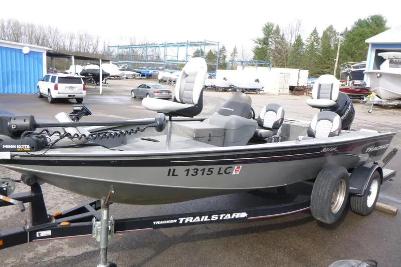 Slide: The Image of 2005 Tracker Tournament V-18 All Fish boat on trailer in parking lot. - 4