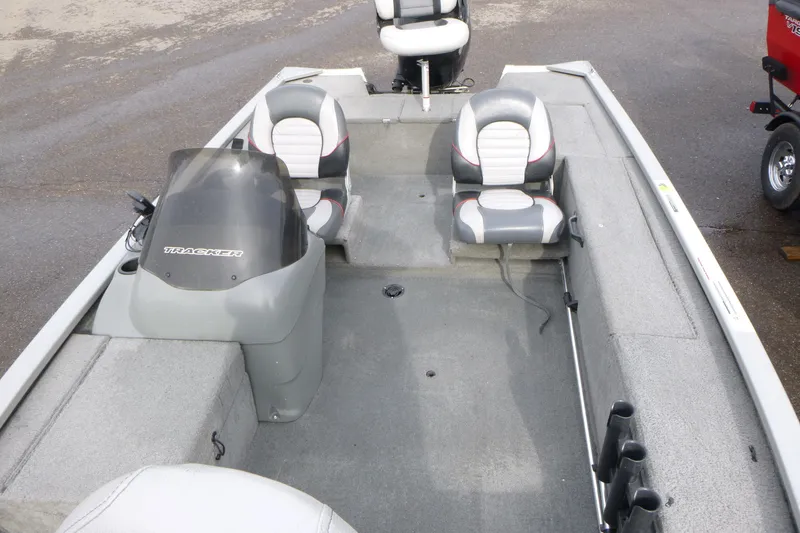 Slide: The Image of 2005 Tracker Tournament V-18 All Fish boat interior with seating and steering console. - 6