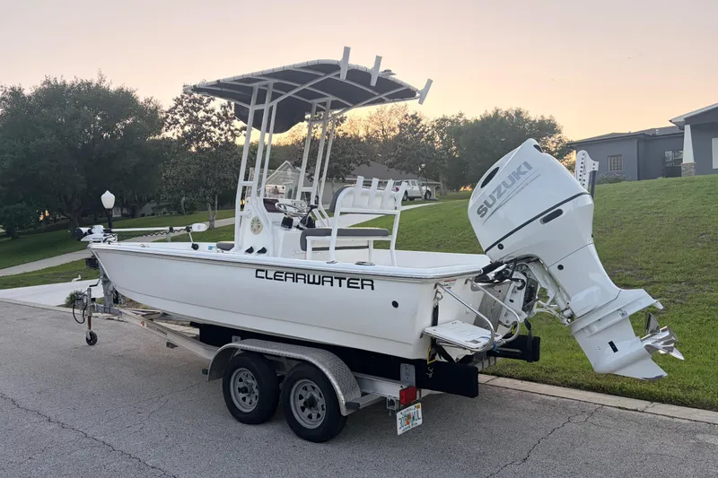 Slide: The Image of 2022 Clearwater 2100 Baystar boat on trailer with Suzuki outboard motor. - 3