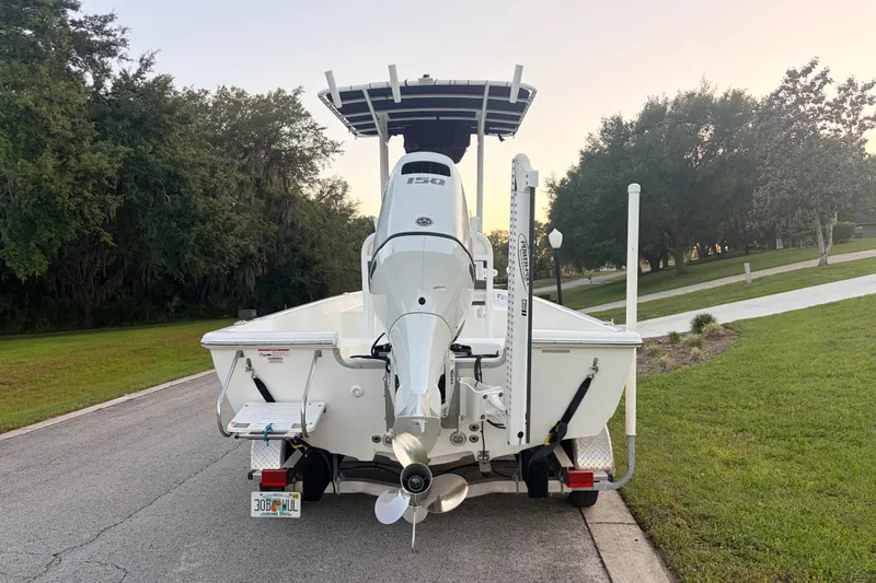 Slide: The Image of 2022 Clearwater 2100 Baystar boat rear view on a suburban street. - 4