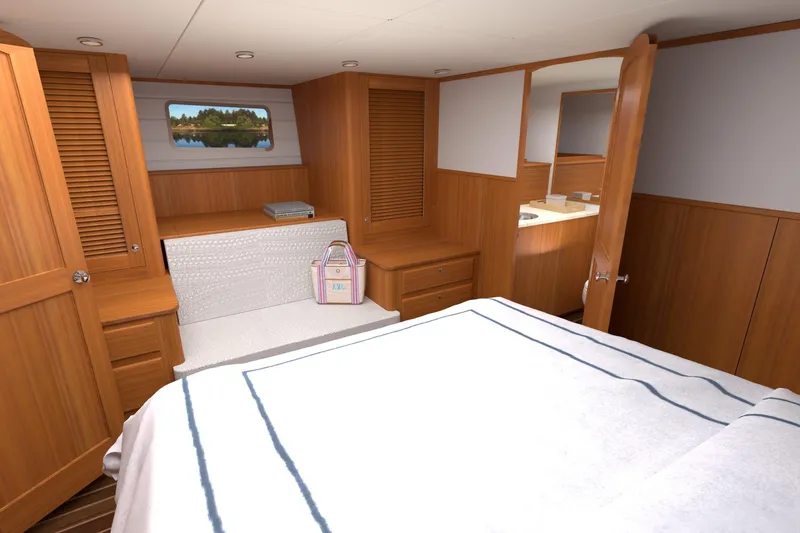 Slide: The Image of Luxurious cabin interior of 2027 Hunt Yachts 56 Ocean Express with wood paneling and cozy bedding. - 14
