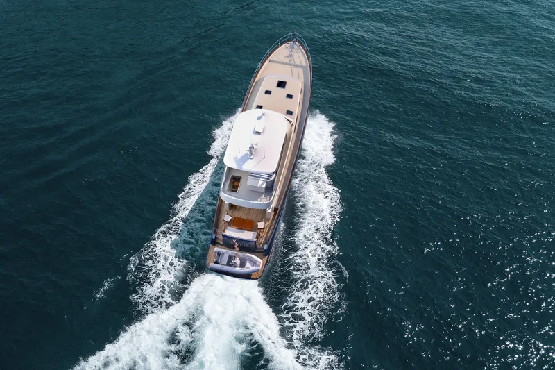 Slide: The Image of Aerial view of 2027 Hunt Yachts 56 Ocean Flybridge cruising on open water. - 3