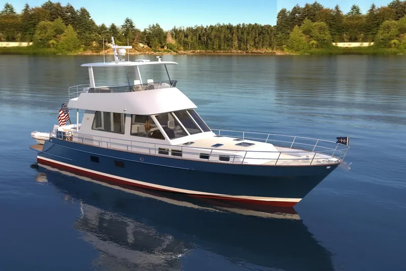 Slide: The Image of 2027 Hunt Yachts 56 Ocean Flybridge cruising on serene waters, surrounded by lush greenery. - 8