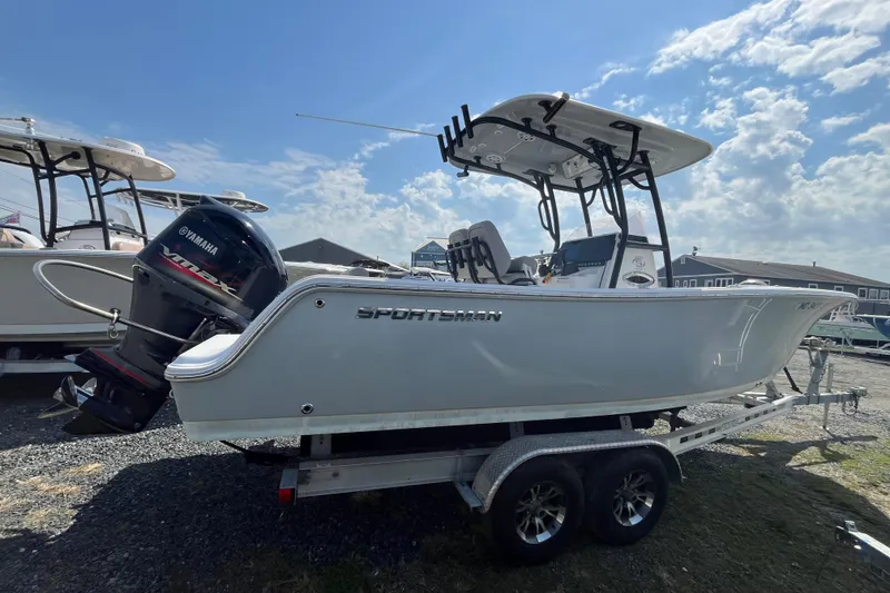 Slide: The Image of 2022 Sportsman Open 242 Center Console boat on trailer, featuring Yamaha outboard motor. - 3