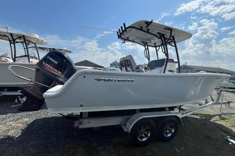 Slide: The Image of 2022 Sportsman Open 242 Center Console boat on trailer, featuring Yamaha outboard motor. - 4
