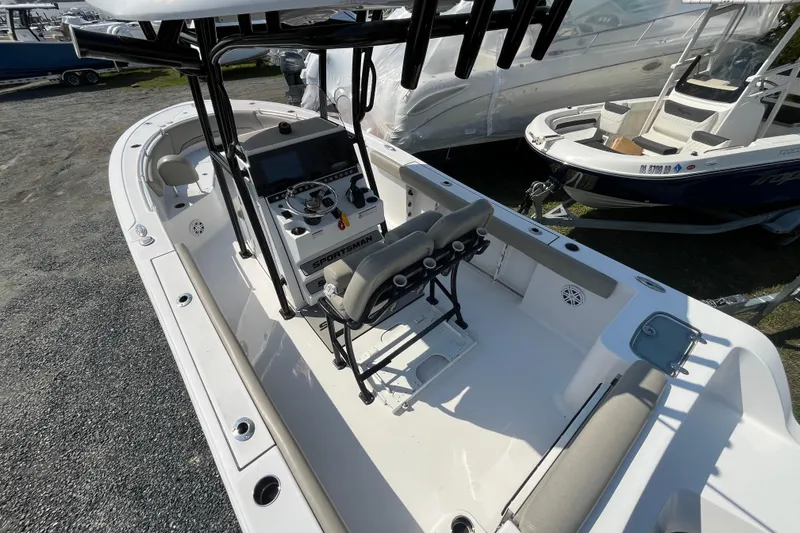 Slide: The Image of 2022 Sportsman Open 242 Center Console boat with dual seating and modern dashboard. - 6