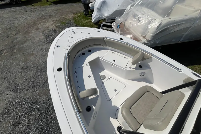 Slide: The Image of 2022 Sportsman Open 242 Center Console boat with spacious seating and storage. - 8
