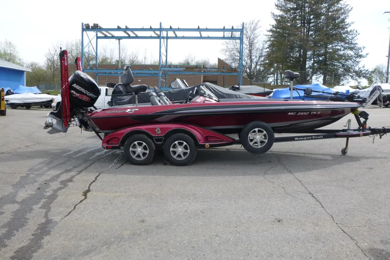 Slide: The Image of 2010 Ranger Z521 boat on trailer with Mercury engine in outdoor setting. - 1
