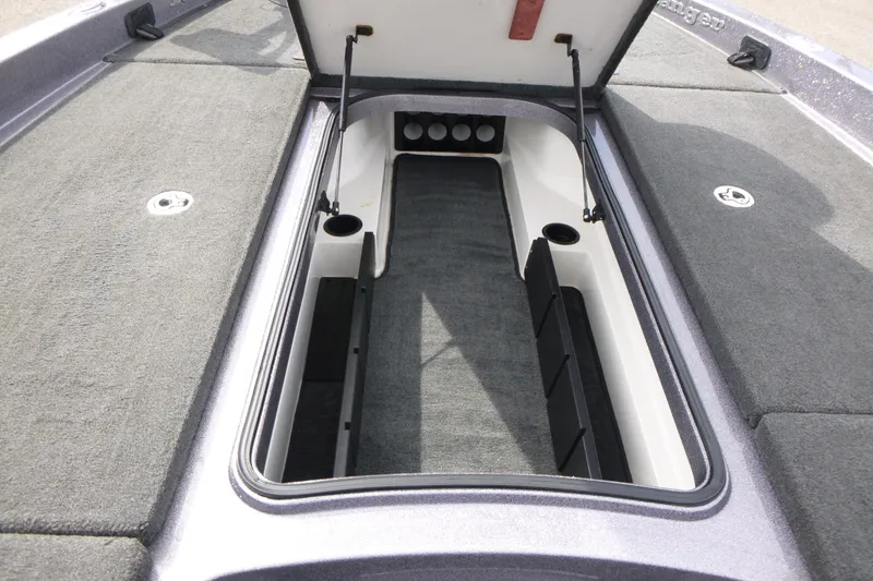 Slide: The Image of Open storage compartment of a 2010 Ranger Z521 boat, showcasing interior design and functionality. - 14