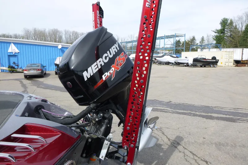 Slide: The Image of 2010 Ranger Z521 boat with Mercury Pro XS engine in a marina setting. - 16