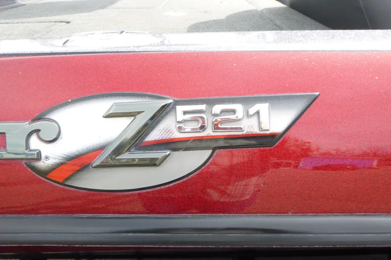 Slide: The Image of 2010 Ranger Z521 logo on a red metallic surface. - 18