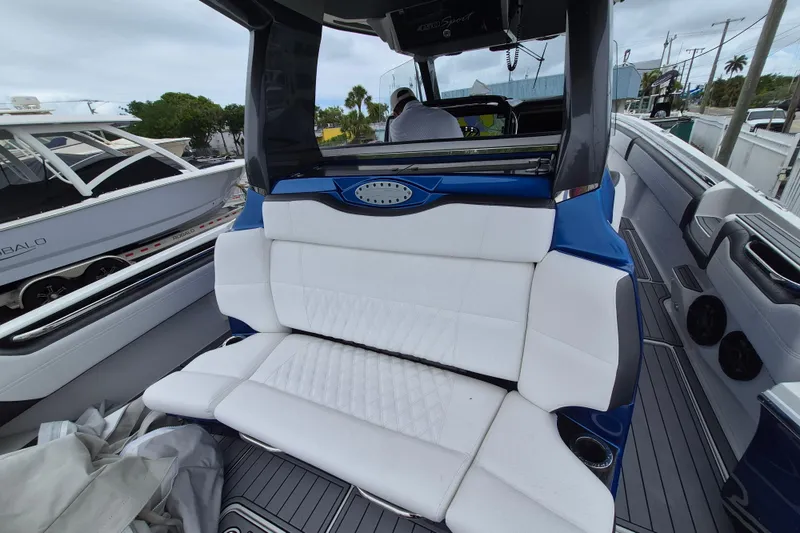 Slide: The Image of 2020 Nor-Tech 450 Sport Center Console with luxurious white seating and sleek design. - 13