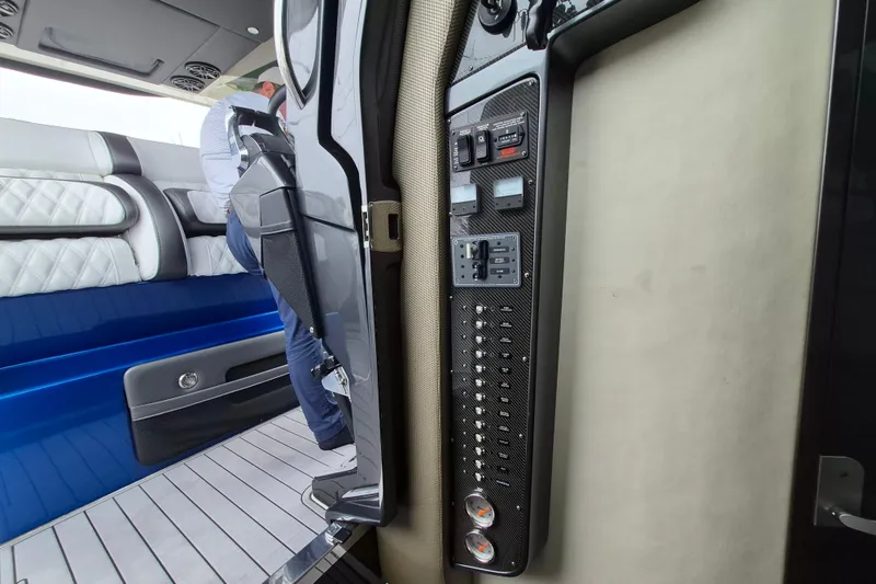 Slide: The Image of Interior view of a 2020 Nor-Tech 450 Sport Center Console boat with control panel. - 19