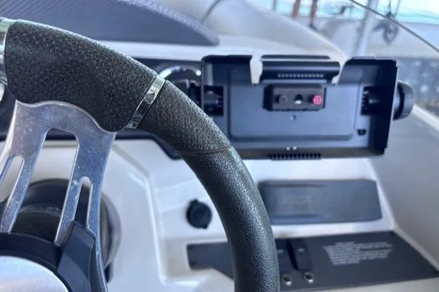 Slide: The Image of Steering wheel and dashboard of 2019 Crest 220 CREST III boat. - 13