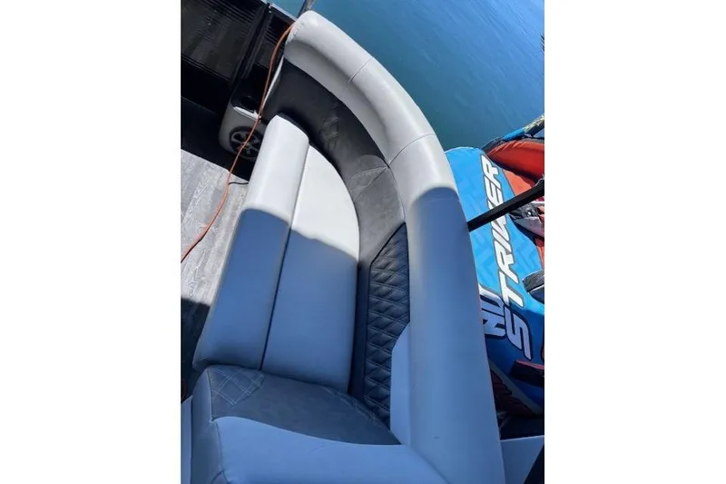 Slide: The Image of 2019 Crest 220 CREST III boat interior with gray seating and water sports equipment. - 17