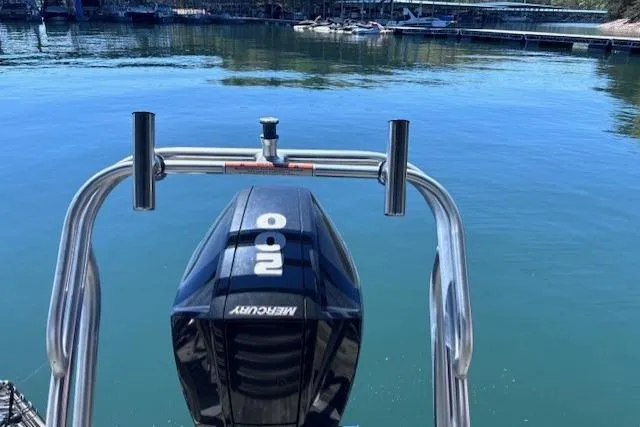 Slide: The Image of 2019 Crest 220 CREST III boat with Mercury outboard motor on a calm lake. - 19