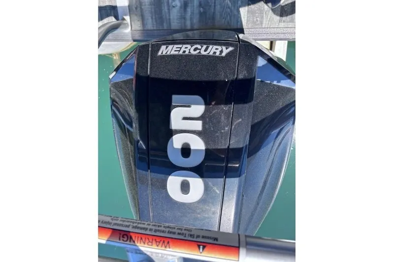 Slide: The Image of Mercury 200 outboard motor on 2019 Crest 220 CREST III boat, docked on water. - 20
