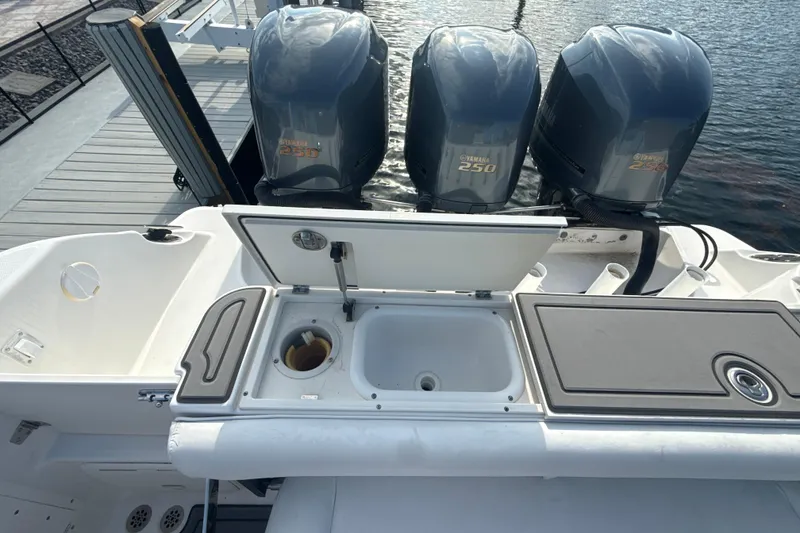 Slide: The Image of 2006 Wellcraft 352 Sport boat with Yamaha 250 engines and onboard sink at dock. - 10