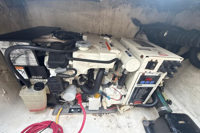 Slide: The Image of Engine compartment of a 2006 Wellcraft 352 Sport boat featuring a Kohler generator. - 20