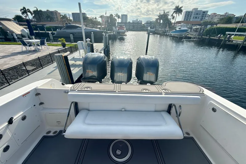 Slide: The Image of 2006 Wellcraft 352 Sport boat with triple engines docked at a marina. - 7