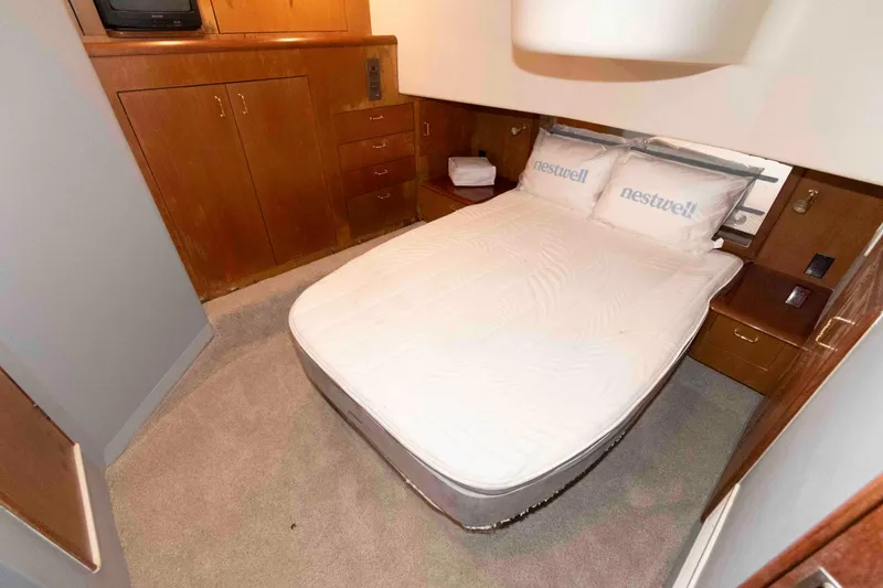 Slide: The Image of Cozy bedroom interior on a 2001 Ocean Yachts 40 Super Sport boat. - 16