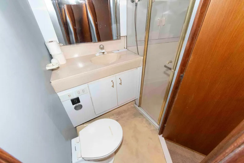 Slide: The Image of Bathroom interior of 2001 Ocean Yachts 40 Super Sport with shower and vanity. - 18