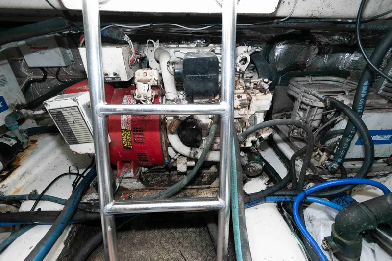 Slide: The Image of Engine room of 2001 Ocean Yachts 40 Super Sport with visible machinery and wiring. - 23