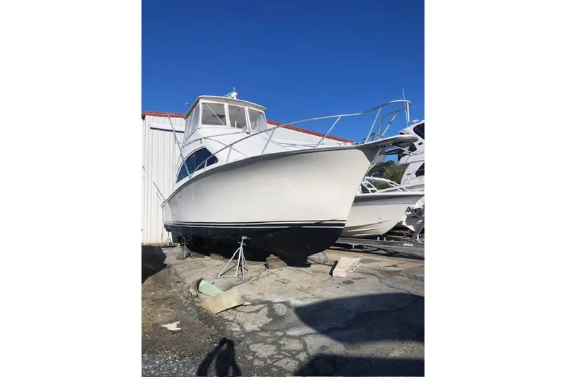 Slide: The Image of Cockpit of 2001 Ocean Yachts 40 Super Sport with steering wheel and navigation equipment. - 6