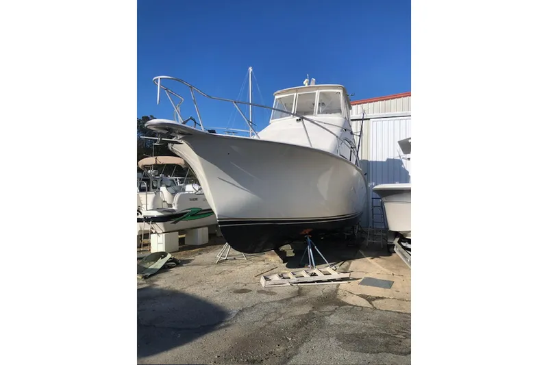 Slide: The Image of Helm of 2001 Ocean Yachts 40 Super Sport with steering wheel and navigation instruments. - 7