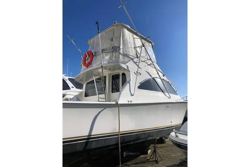 Slide: The Image of Helm of 2001 Ocean Yachts 40 Super Sport with steering wheel and navigation controls. - 8