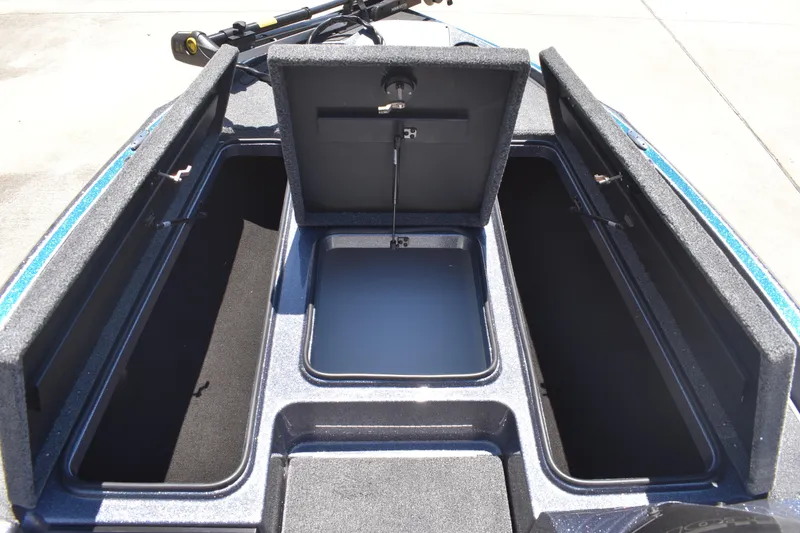 Slide: The Image of 2026 Triton 179 TrX boat storage compartments open, showcasing spacious interior design. - 15