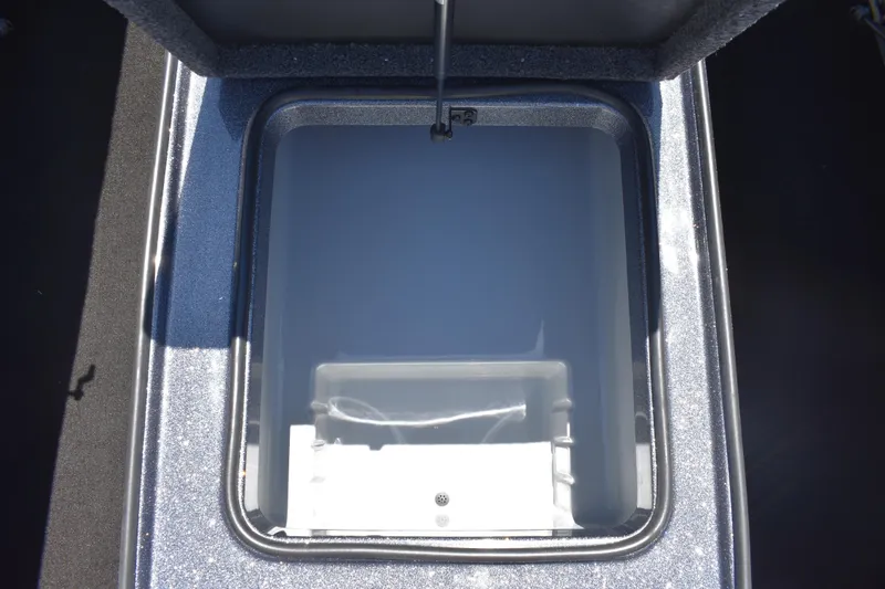 Slide: The Image of Open storage compartment in 2026 Triton 179 TrX boat, showcasing interior space. - 16