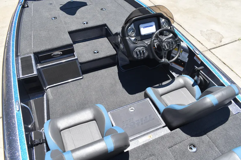 Slide: The Image of 2026 Triton 179 TrX boat interior with dual seats and modern dashboard. - 21