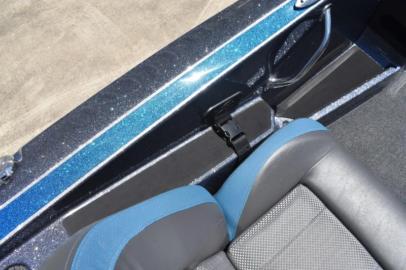 Slide: The Image of 2026 Triton 179 TrX boat interior with blue and gray seating and metallic finish. - 22