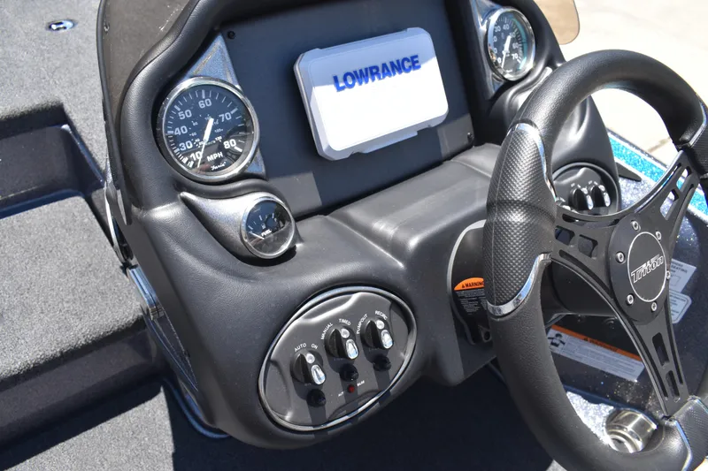 Slide: The Image of Dashboard of 2026 Triton 179 TrX boat with steering wheel and gauges. - 30