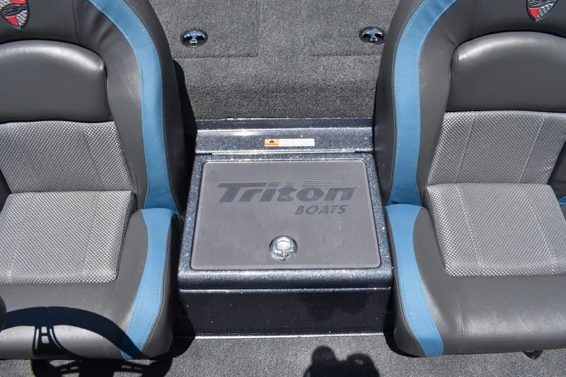 Slide: The Image of Interior of 2026 Triton 179 TrX boat with dual seats and branded storage compartment. - 33