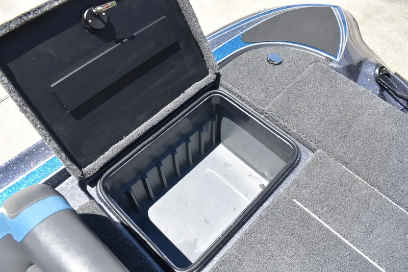 Slide: The Image of Open storage compartment on 2026 Triton 179 TrX boat deck. - 40
