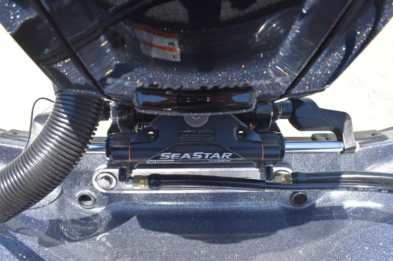 Slide: The Image of Close-up of SeaStar hydraulic steering system on 2026 Triton 179 TrX boat. - 41