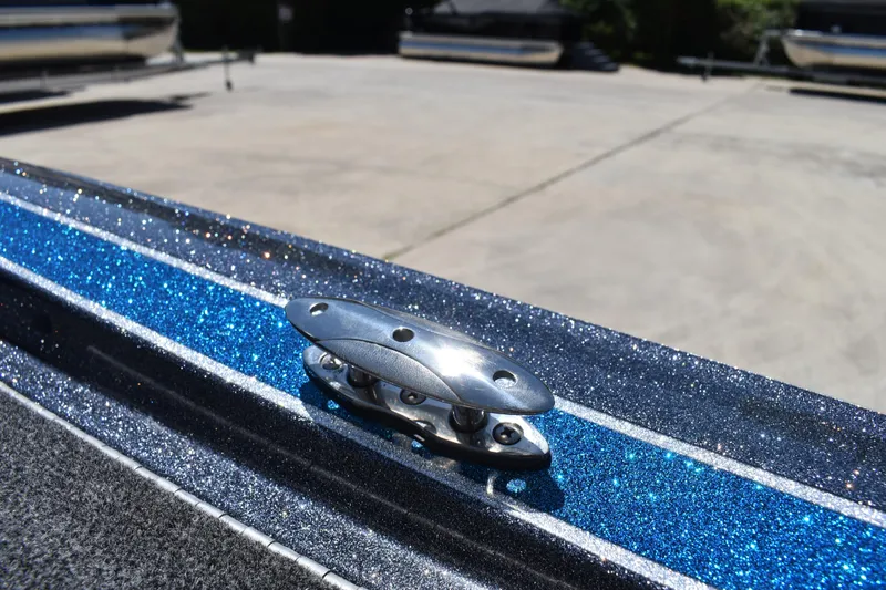 Slide: The Image of 2026 Triton 179 TrX boat with metallic blue finish and chrome cleat detail. - 43